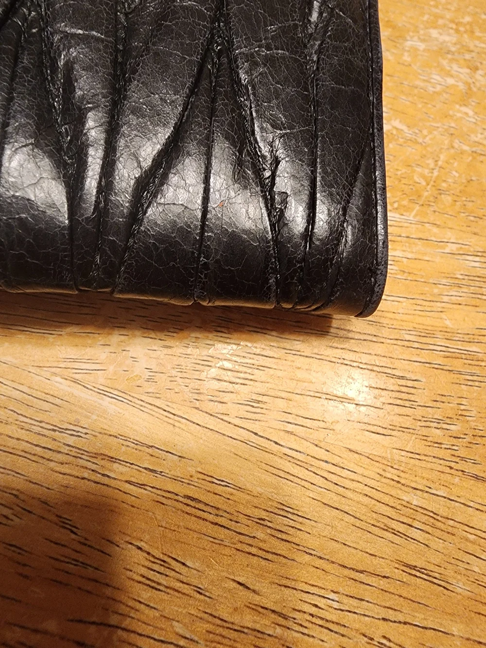 black quilted leather Miu Miu Matelassé long bifold wallet gold-tone Logo